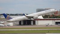 N75854 @ TPA - United 757-300 carrying Tampa Bay Buccaneers NFL team - by Florida Metal