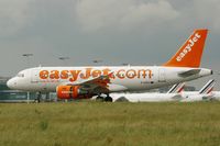 G-EZEV @ LFPG - Airbus A319-111, Reverse thrust landing Rwy 26L, Roissy Charles De Gaulle Airport (LFPG-CDG) - by Yves-Q