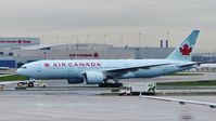 C-FNNH @ CYYZ - Air Canada Boeing 777 on a wet morning. - by M.L. Jacobs