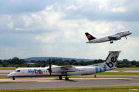 G-JEDW @ EGCC - Taxi to the gate and Manchester Airport background action - by Clive Pattle