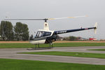 G-HBMW @ EGBR - Robinson R22 at the Real Aeroplane Club's Helicopter Fly-In, Breighton Airfield, North Yorkshire, September 21st 2014. - by Malcolm Clarke