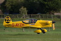 G-AYZH @ EGTH - Getting airborne at the Shuttleworth Trust's 2014 'Race Day' airshow for an F1 racing demo (with Cosmic Wind G-ARUL) - by alanh