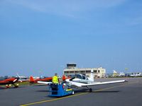 OO-MAR @ EGJB - Unusual sight on Guernsey Airport apron.OOMAR was being towed by the local ground handling staff shortly after its landing. In the background the UK aerobatic Team the blades is closely parked awaiting the annual local seafront airshow held 2 days later - by Molitor Dominique