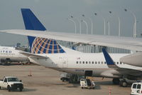 N13718 @ KORD - Parked at gate - by Daniel Vanderauwera