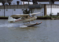 N2450E @ 2N7 - The plane in which I got my seaplane rating, a 1946 Aeronca S7CCM, N2450E taking off, Little Ferry Sea Plane Base, 1972. - by Mike Boland