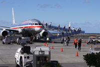 N193AN @ KOA - Passengers de-planing at Kona - by metricbolt