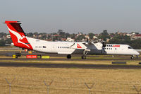 VH-QOY @ YSSY - TAXIING FROM 34R - by Bill Mallinson