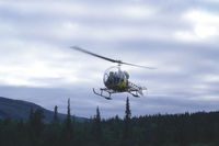 SE-HCA @ N.A. - Bell 47 taking off from a clearing in the forest at Pårtestugorna (mountain hut) near Kvikkjokk in Swedish Lappland. - by Henk van Capelle