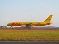 VH-TCA @ NZAA - taxying past to cargo stand - by magnaman