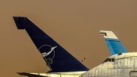 YK-AHA @ OERK - Dusty day in Riyadh Airport  and looking sadly to these two B747SP Syrian Airlines which are out of service - by Odai Ayyad