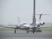 VH-FMU @ YBBN - with VH-JGB biz jet in background. On GA ramp. - by magnaman