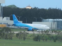 VH-VLI @ YBBN - nice colour scheme - shame on far side of airport - by magnaman