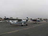 N300FT @ SZP - Two Helio H-295 SUPER COURIER STOL aircraft; one converted to HT-295 tri-gear. N300FT is a 1971 H-295, N5072K behind is a 1967 converted to HT-295. Unusual pair seen together. - by Doug Robertson