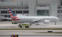 N728AN @ MIA - American 777-300 water canon salute - by Florida Metal