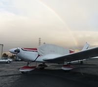N9049W @ KRHV - A long time local Piper Cherokee sits next to the Laffery Aircraft Sales hangar just after an afternoon rain shower at Reid Hillview. Beautiful rainbow in the background! - by Chris L.