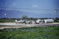 N1280W @ PRIV - Refilling chemical tanks for another crop - by Jon Adamson