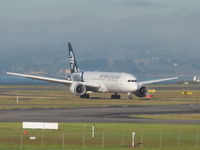 ZK-NZF @ NZAA - taxying off runway - by magnaman