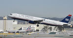 N564UW @ KLAX - Departing LAX on 25R - by Todd Royer