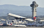 N581NW @ KLAX - Departing LAX on 25R - by Todd Royer
