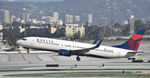 N395DN @ KLAX - Departing LAX on 25R - by Todd Royer