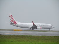 VH-YIU @ NZAA - Taking off on very wet runway - by magnaman