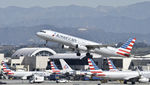 N521UW @ KLAX - Departing LAX on 25R - by Todd Royer