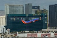 N231WN @ KLAS - Southwest Airlines, is here climbing out at Las Vegas Int'l(KLAS) in front of the famous MGM Grand Hotel - by A. Gendorf