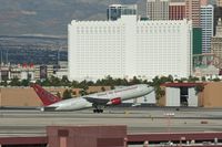 N234AX @ KLAS - Omni Air International, is here departing in front of the Tropicana Hotel at Las Vegas Int'l(KLAS) - by A. Gendorf