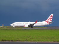VH-VOY @ NZAA - departing after the storm - by magnaman