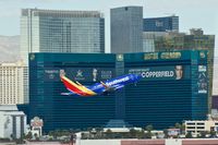 N905WN @ KLAS - Southwest Airlines, is here departing Las Vegas Int'l(KLAS) in front of the MGM Grand Hotel - by A. Gendorf