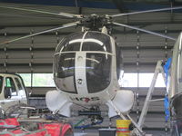 ZK-HGS @ NZKK - inside Campbell copters hangar - by magnaman