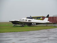 ZK-NZA @ NZWR - Only aircraft to see at wet & windy Whangarei. Aircraft no longer on NZ register. - by magnaman