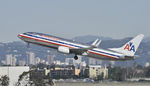 N958AN @ KLAX - Departing LAX on 25R - by Todd Royer