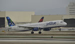 N923JB @ KLAX - Landing at LAX on 7R - by Todd Royer