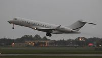 N46GX @ ORL - Global 6000 taking off in a storm