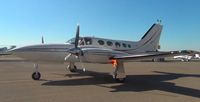 N678SW @ KRHV - A transient Cessna 421C (Monterey, CA) starting up at the inside ramp after dropping off passengers at Reid Hillview Airport, CA. The flame from the exhaust was pretty cool. - by Chris Leipelt