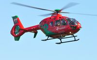 G-WASN @ EGFH - Wales Air Ambulance helicopter (Helimed 57) returning to base with a recently applied green dragon's tail emblem. - by Roger Winser