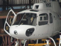 ZK-HHX @ NZMB - Hiding in mechanics bay hangar - long shot from harbour edge - by magnaman