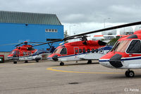 G-PUMO @ EGPD - Sitting with her CHC sisters at Aberdeen Airport, Scotland EGPD - by Clive Pattle
