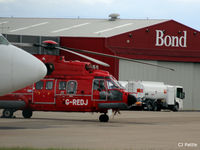 G-REDJ @ EGPD - Hiding behind a B737 cargo at Aberdeen Airport, Scotland EGPD - by Clive Pattle