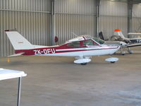 ZK-DFU @ NZNE - In flying club hangar viewed from spectator area - by magnaman