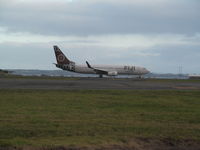 DQ-FJG @ NZAA - landing at dusk - by magnaman