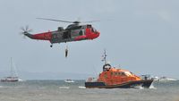 XV661 - Off airport. Royal Navy Sea King HU.5 helicopter coded (8)26 0f 771 NAS in a rescue demonstration with The Mumbles Lifeboat on the first day of the Wales National Airshow held over Swansea Bay. - by Roger Winser
