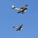 G-EBWD @ EGTH - 45. DH60X Moth about to pass DH82A Tiger Moth during the Mock (handicapped) Air Race at Shuttleworth Wings and Wheels Airshow, Aug. 2015. - by Eric.Fishwick