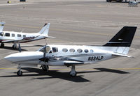 N884LP @ KVGT - Brecton Aviation 1976 Cessna 421C from KLBB repositioning on transient ramp @ North Las Vegas Airport, NV - by Steve Nation