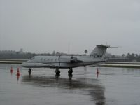 PT-LMY @ SCES - Learjet 35A getting soaked on ground Salvador, Chile - by Jetops1