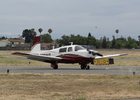 N201UT @ KRHV - A very nice local 1977 Mooney M20J clear of 31R and taxing to its tie down under the shelters at Reid Hillview Airport, CA. - by Chris Leipelt