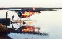 N53H - Don Porter and Rita Brown with Howard N53H near Bethel, Alaska during summer of 1976. - by Greg Bollendonk