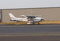 N2377P @ KPAE - Cessna 182 taxing by the fire department. - by Eric Olsen