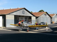 N78J @ SZP - 1942 Ryan Aeronautical ST-3KR as PT-22, Kinner R-5 160 Hp radial, engine warm-up after hand propping start by owner in green shirt. - by Doug Robertson